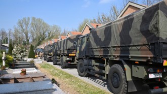 A convoy of Italian Army trucks arrives from Bergamo carrying bodies of coronavirus victims to the cemetery of Ferrara, Italy, where they will be cremated, Saturday, March 21, 2020. The transfer was made necessary since Bergamo mortuary reached maximum capacity. For most people, the new coronavirus causes only mild or moderate symptoms. For some it can cause more severe illness, especially in older adults and people with existing health problems. (Massimo Paolone/LaPresse via AP)